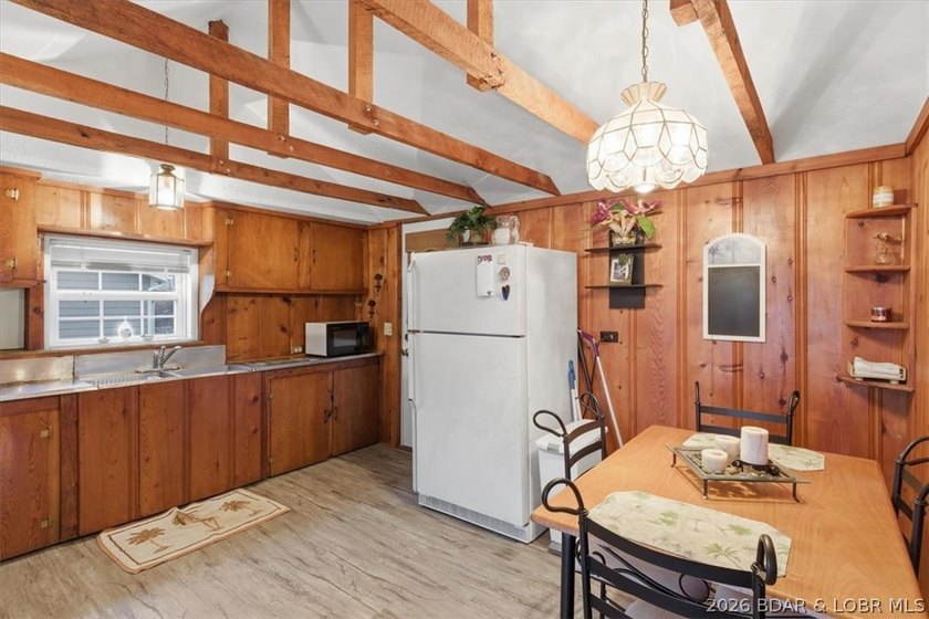 Discover this unique 2-bedroom, 1-bath lakefront cabin offering - photo 13