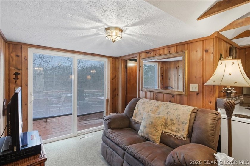 Discover this unique 2-bedroom, 1-bath lakefront cabin offering - photo 14