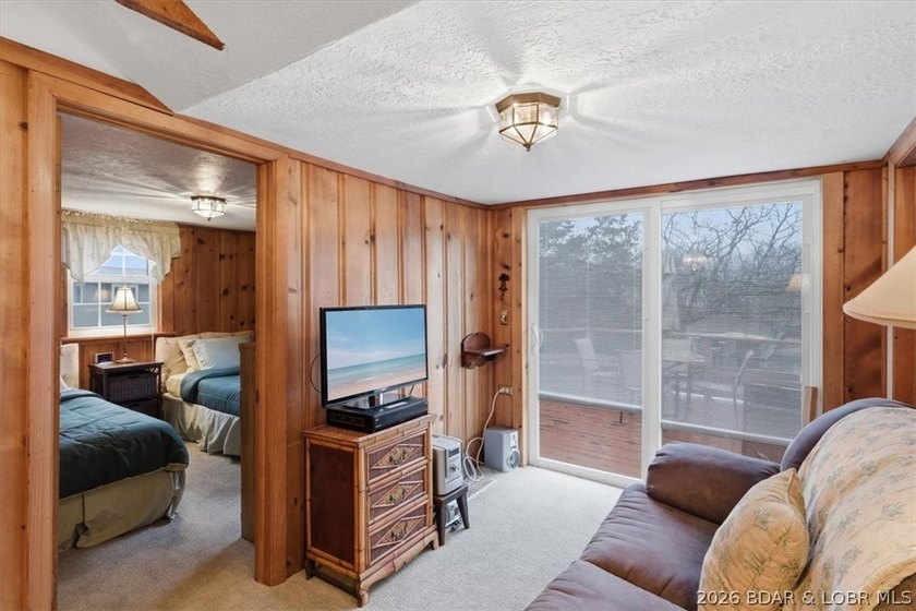Discover this unique 2-bedroom, 1-bath lakefront cabin offering - photo 15
