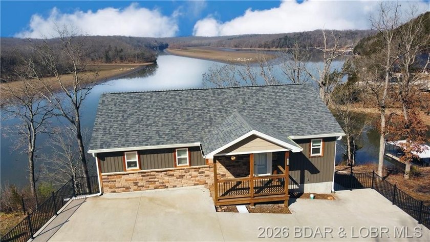 This 3-bedroom, 2.5-bath lakefront home offers over 2,000 square - photo 2