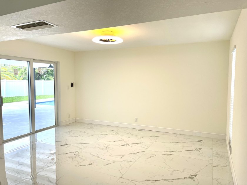 Completely renovated 4-bedroom, 2-bath home with a stunning - photo 11