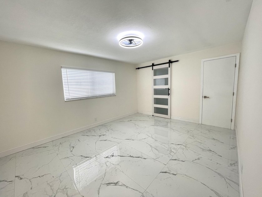 Completely renovated 4-bedroom, 2-bath home with a stunning - photo 13