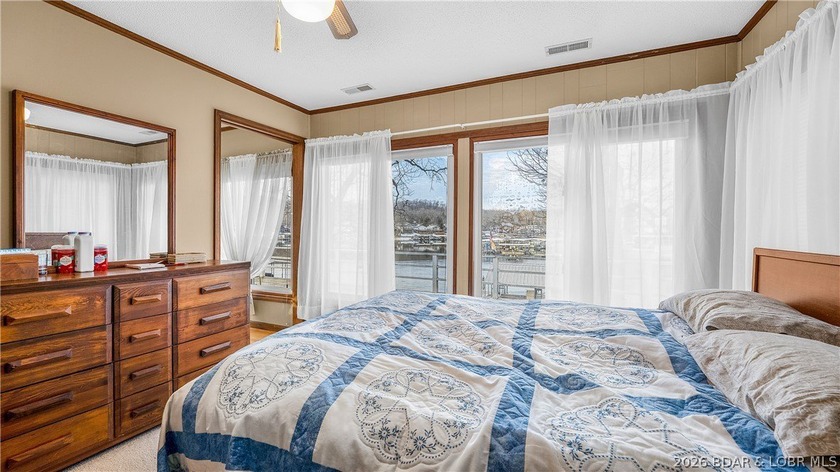 Don't miss this wonderful lake home located at the 8-mile marker - photo 10