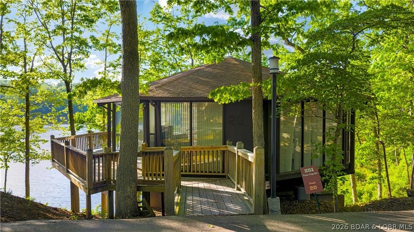 Enjoy treehouse-style living with true lakefront views and all - photo 13