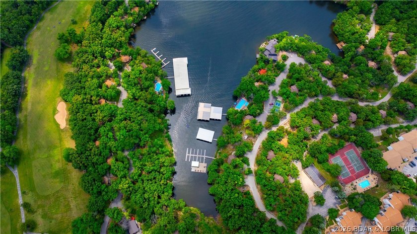 Enjoy treehouse-style living with true lakefront views and all - photo 15