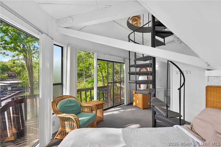 Enjoy treehouse-style living with true lakefront views and all - photo 18