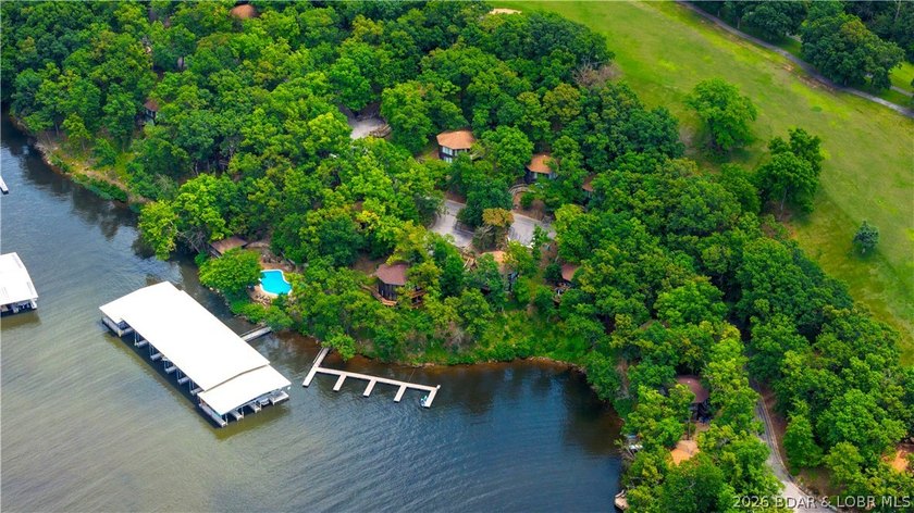 Enjoy treehouse-style living with true lakefront views and all - photo 23