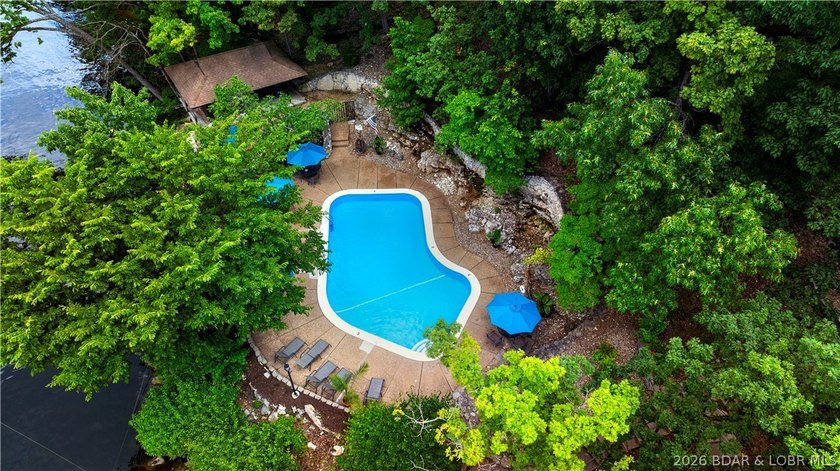 Enjoy treehouse-style living with true lakefront views and all - photo 36