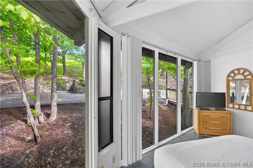 Enjoy treehouse-style living with true lakefront views and all - photo 44