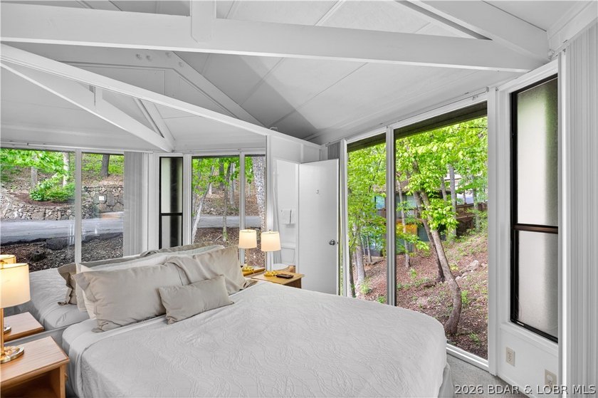 Enjoy treehouse-style living with true lakefront views and all - photo 47