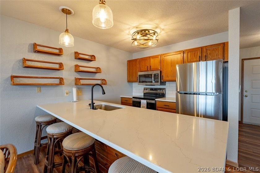 Experience lake life at its finest in this stunning two-level, 1 - photo 8