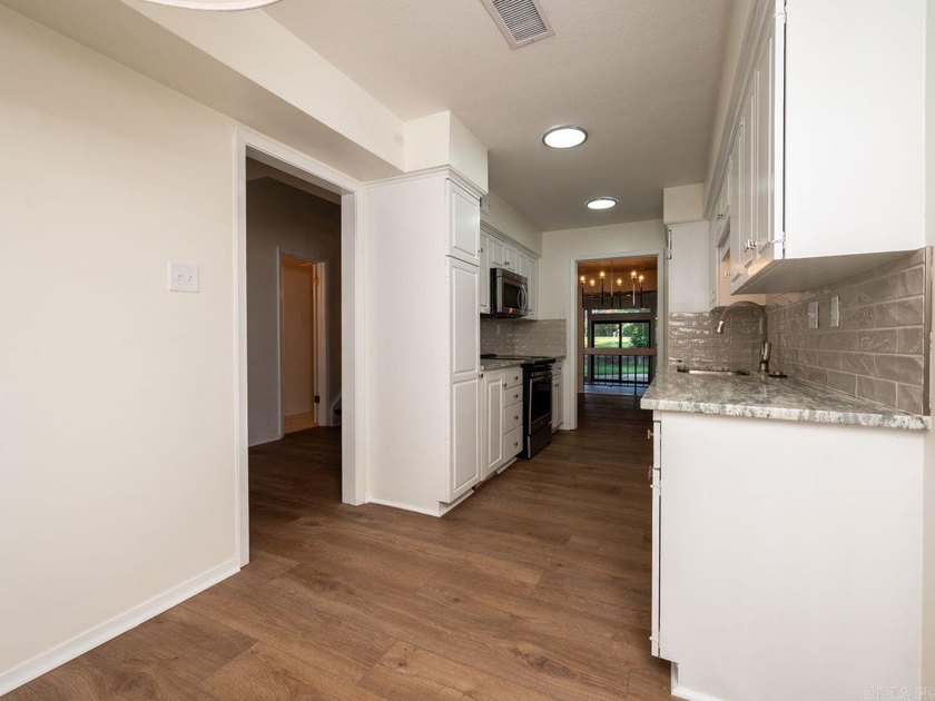 Enjoy refined, low-maintenance living in this fully renovated - photo 13