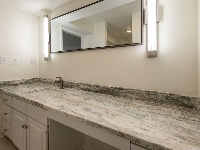 Enjoy refined, low-maintenance living in this fully renovated - photo 25