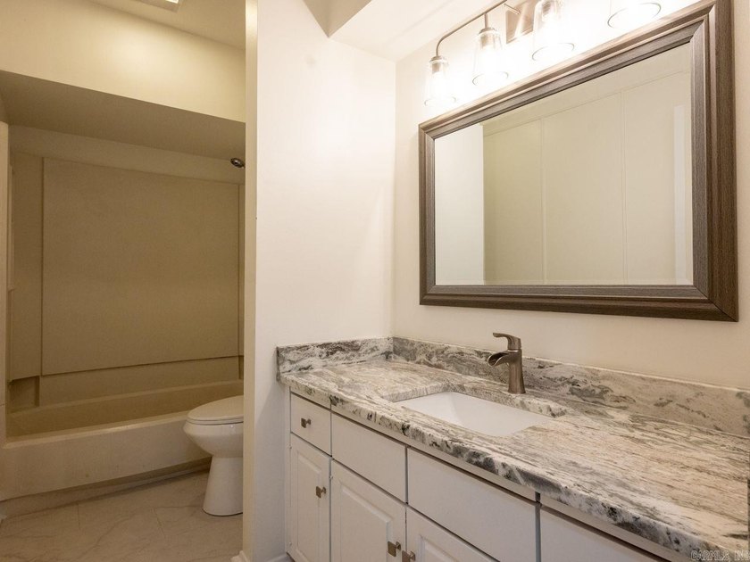 Enjoy refined, low-maintenance living in this fully renovated - photo 35