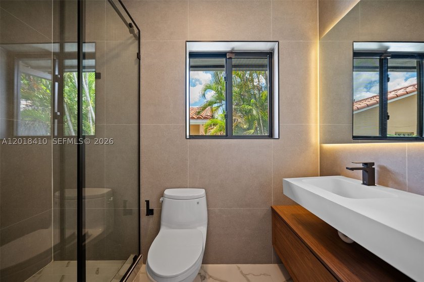 Step into this meticulously renovated residence in the Western - photo 25