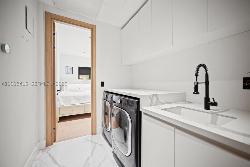 Step into this meticulously renovated residence in the Western - photo 31