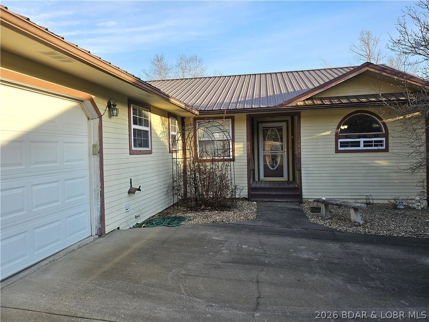 This lakefront homes has many pluses: one level living, attached - photo 6
