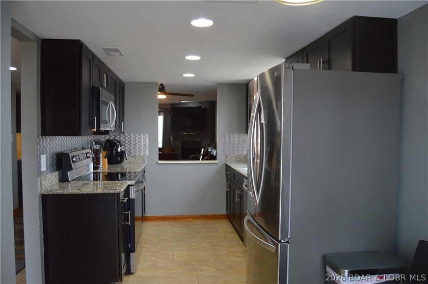 This ground-floor, 1-story, end unit offers plenty of room for - photo 10