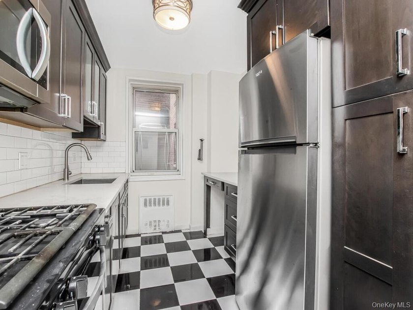 Welcome to this sun-filled, spacious one-bedroom corner co-op in - photo 3