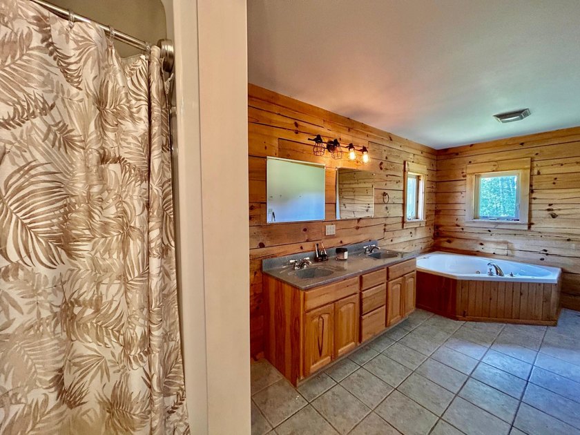 Your Northwoods dream home awaits! Nestled on 14.68 acres, this - photo 18
