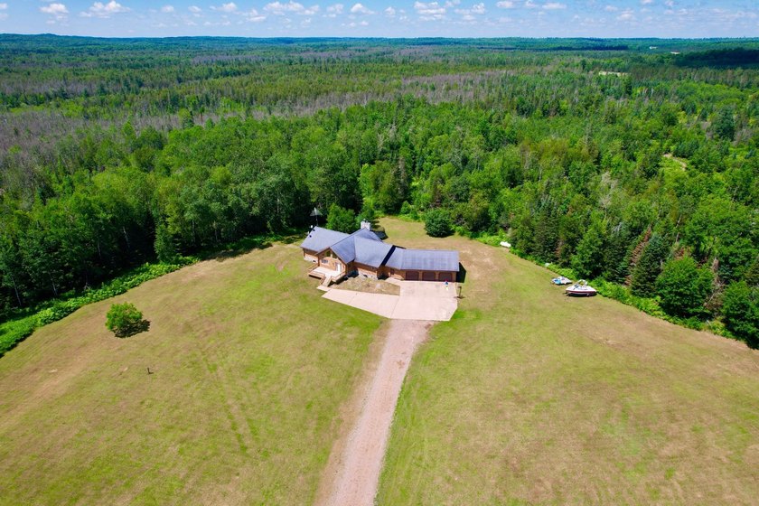 Your Northwoods dream home awaits! Nestled on 14.68 acres, this - photo 29