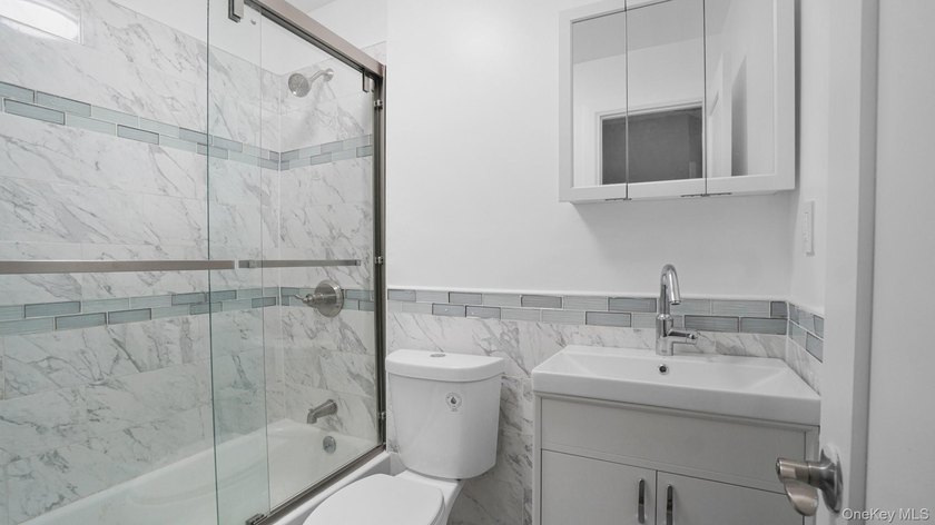 Fully renovated 2-family, 2007 brick-built house. Features 3 bed - photo 15