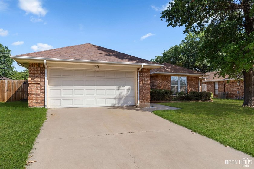 Welcome to this charming 3-bedroom, 2-bath home in the highly - photo 2
