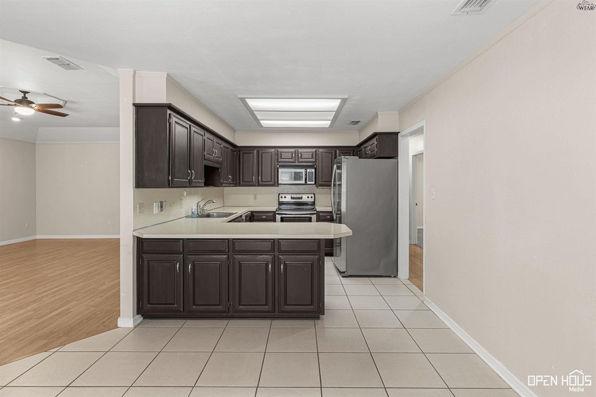 Welcome to this charming 3-bedroom, 2-bath home in the highly - photo 10