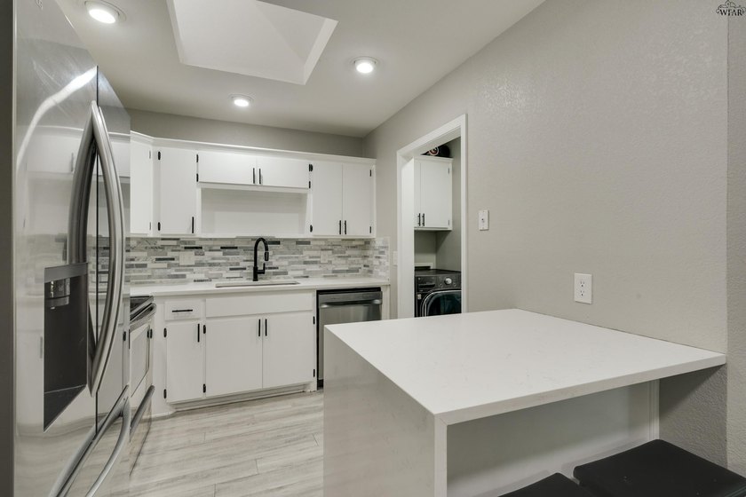 Picture mornings in a 2023-remodeled kitchen, with quartz - photo 9