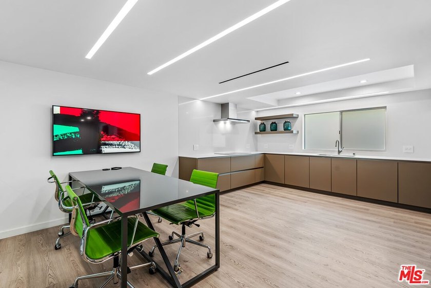 This extensively renovated front-facing multi-story townhome - photo 12
