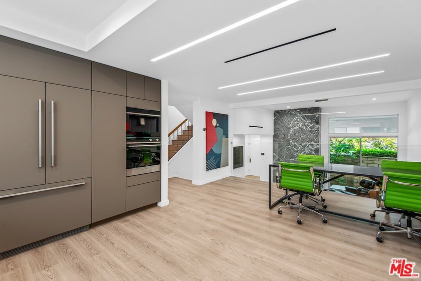 This extensively renovated front-facing multi-story townhome - photo 15