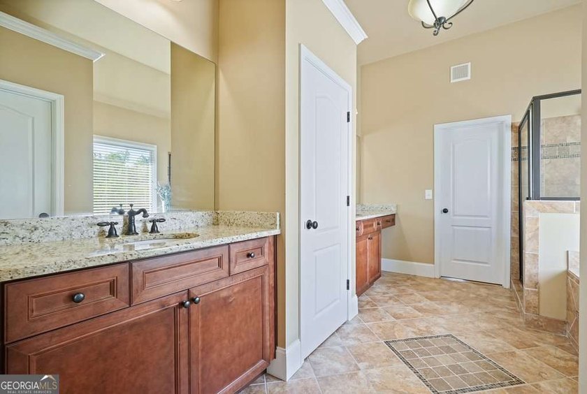 Welcome home to this move-in-ready 5BR/4BA custom home in the - photo 11