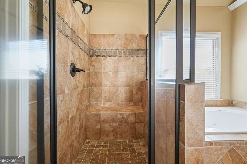 Welcome home to this move-in-ready 5BR/4BA custom home in the - photo 13
