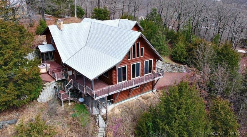 A VIEW FOR MILES! This one-of-a-kind custom log home showcases - photo 2