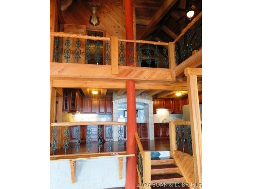 A VIEW FOR MILES! This one-of-a-kind custom log home showcases - photo 10