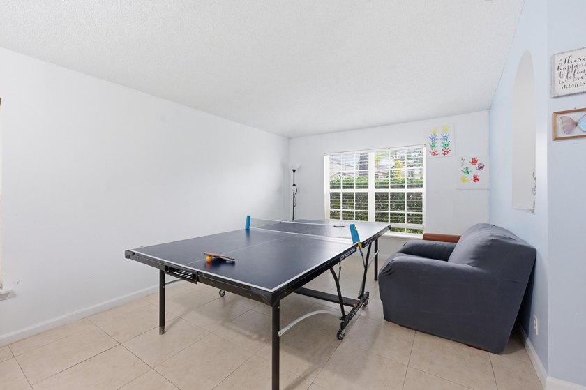 Spacious home with high ceilings and a bright, open layout. The - photo 12
