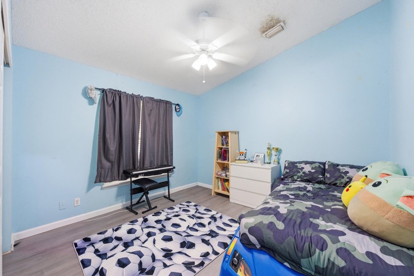Spacious home with high ceilings and a bright, open layout. The - photo 21