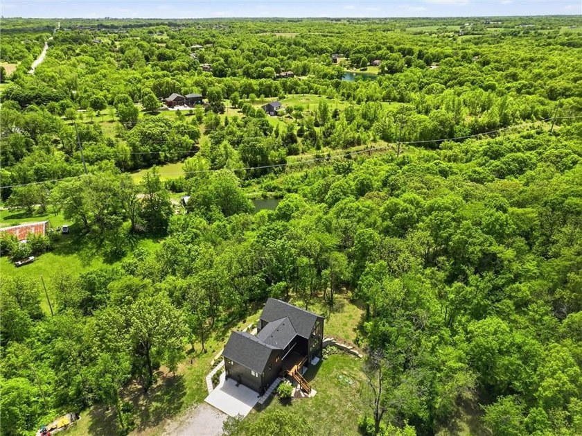 Welcome to a modern masterpiece set on 30-acres that captures - photo 5