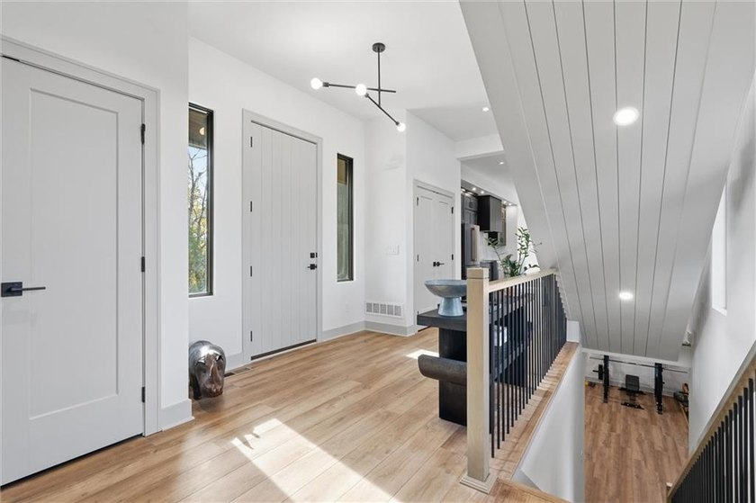 Welcome to a modern masterpiece set on 30-acres that captures - photo 6