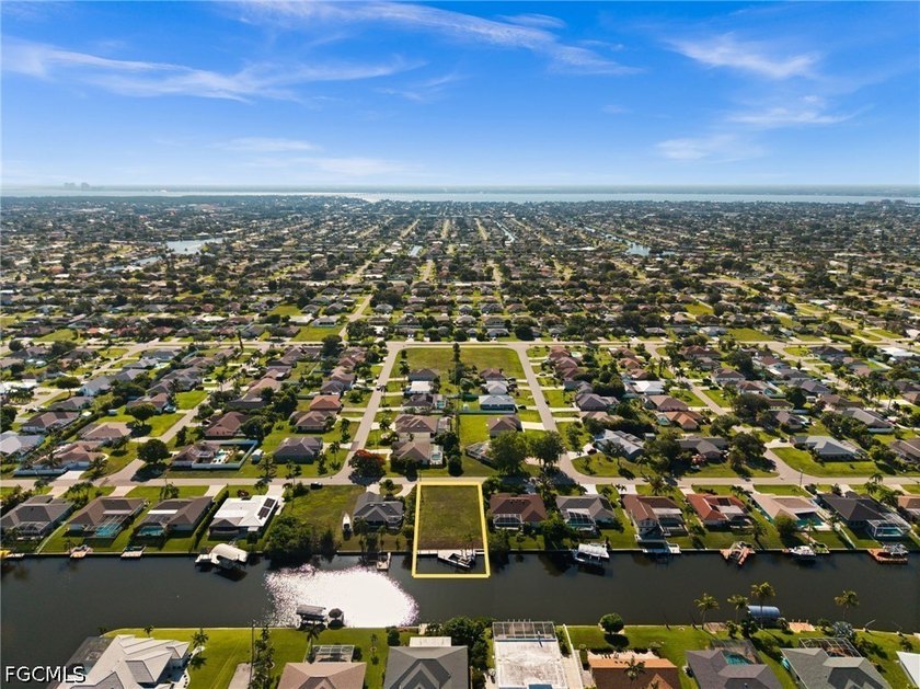 GULF ACCESS LOT WITH A NEWER SEAWALL, DOCK, CAPTAIN'S WALK, AND - photo 12