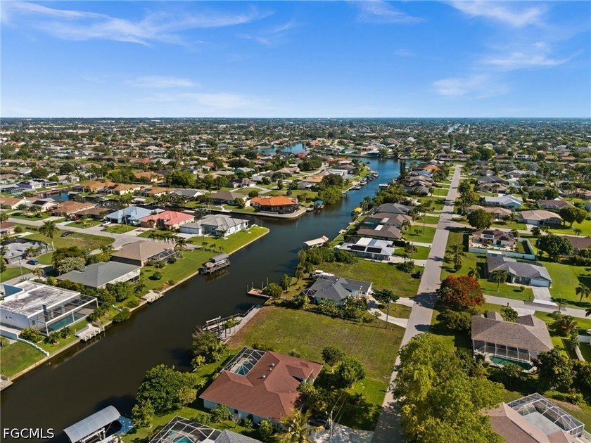 GULF ACCESS LOT WITH A NEWER SEAWALL, DOCK, CAPTAIN'S WALK, AND - photo 18