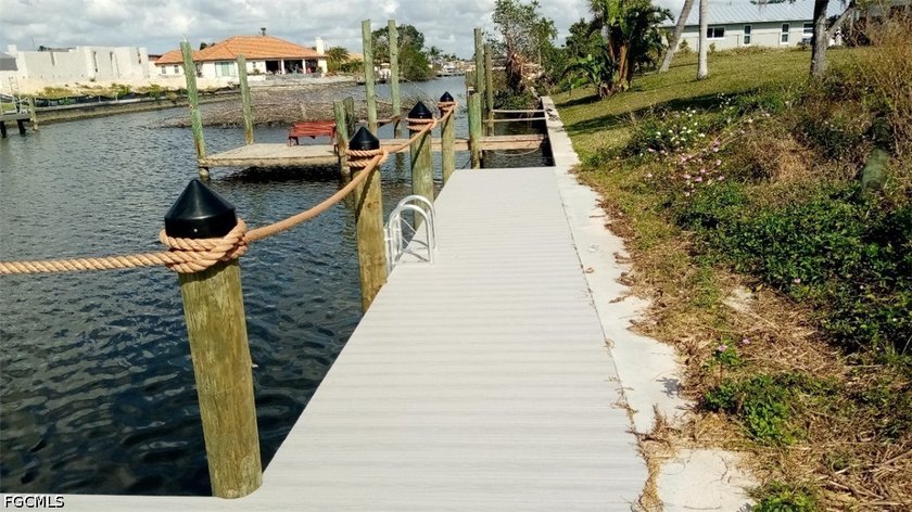 GULF ACCESS LOT WITH A NEWER SEAWALL, DOCK, CAPTAIN'S WALK, AND - photo 21