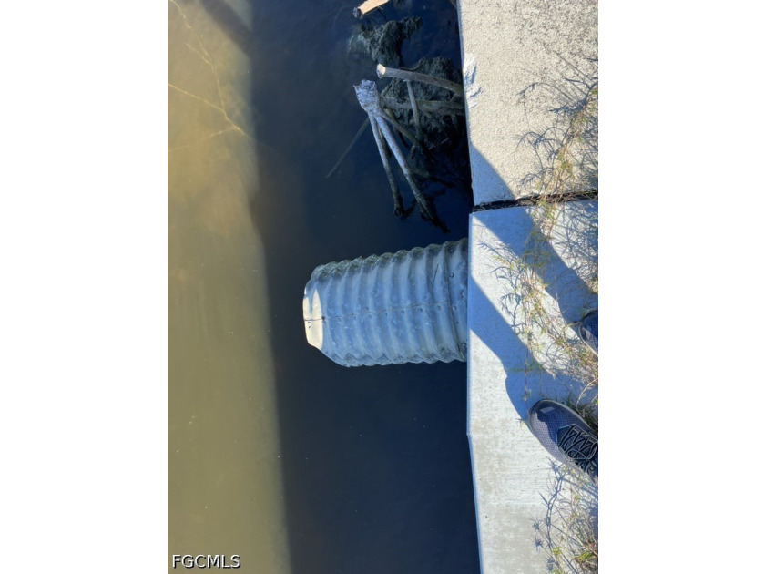 GULF ACCESS LOT WITH A NEWER SEAWALL, DOCK, CAPTAIN'S WALK, AND - photo 22