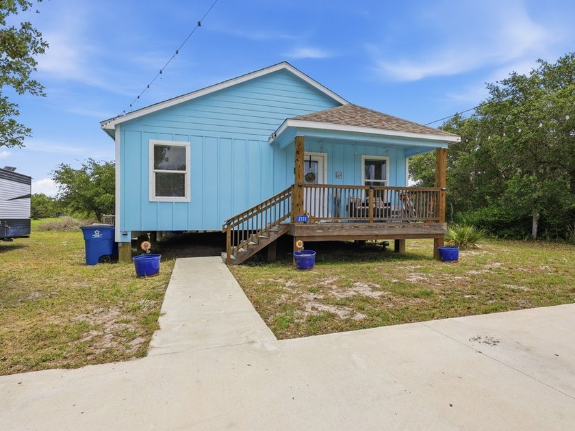 Built in 2021, this 3-bedroom, 2-bath coastal cottage sits on - photo 24