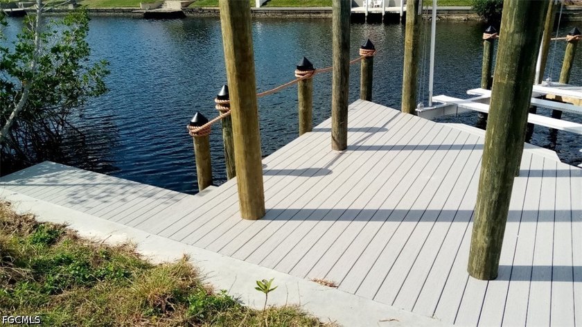 GULF ACCESS LOT WITH A NEWER SEAWALL, DOCK, CAPTAIN'S WALK, AND - photo 24