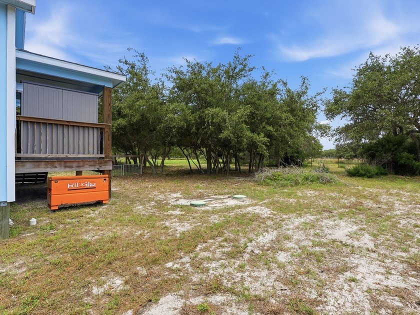 Built in 2021, this 3-bedroom, 2-bath coastal cottage sits on - photo 26