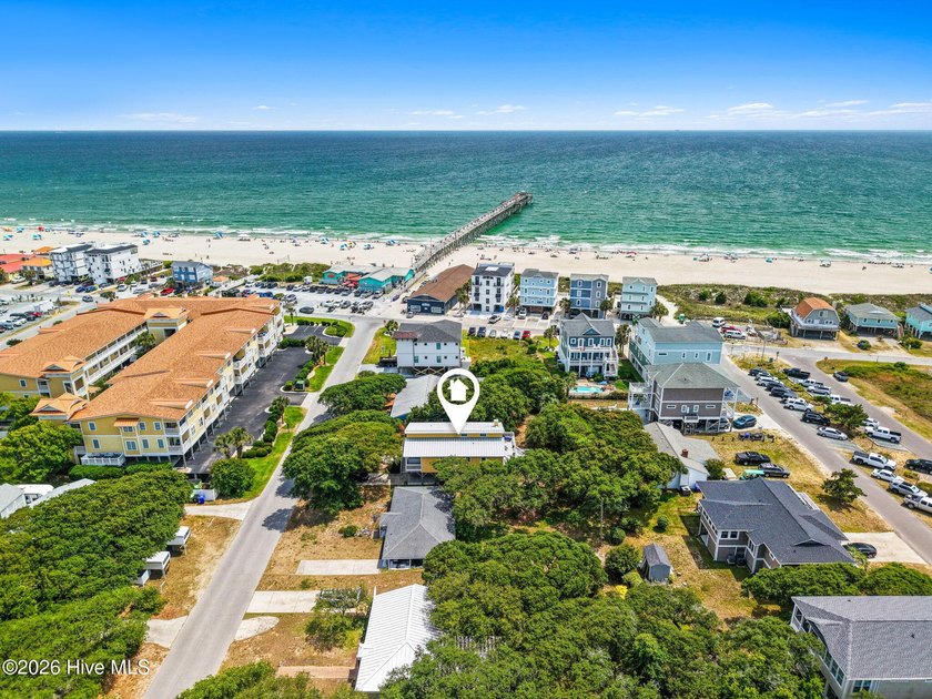 Nestled in the highly sought-after ocean side of Oak Island's - photo 2
