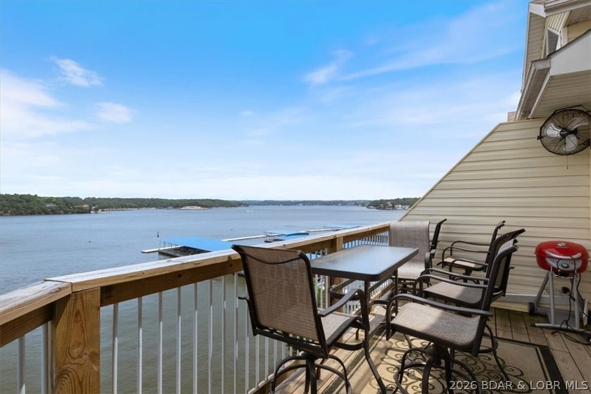 This beautifully updated condo sits high above the lake with - photo 2