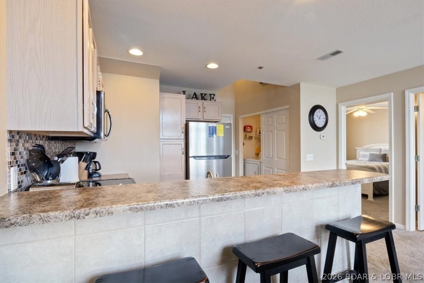 This beautifully updated condo sits high above the lake with - photo 10