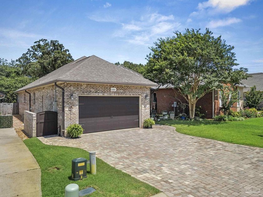 Experience refined luxury in this custom patio home. The - photo 3